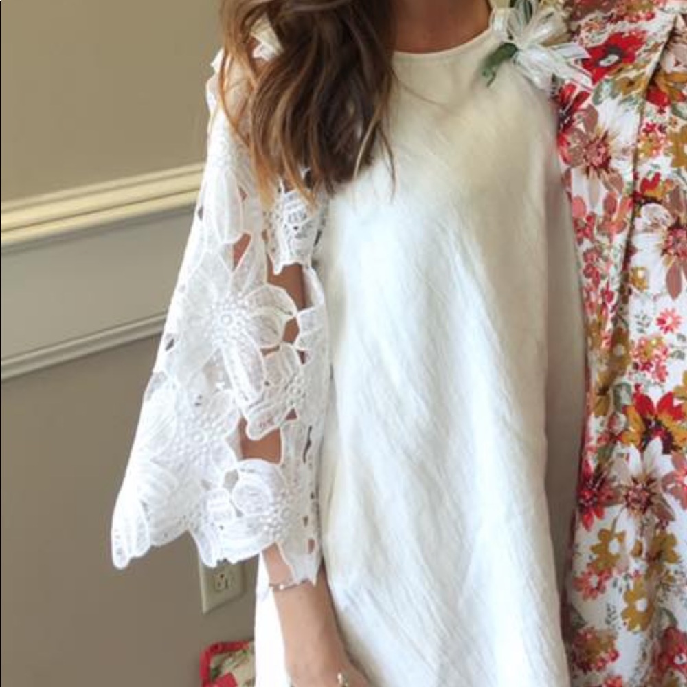 White dress with lace bell sleeves. Size small